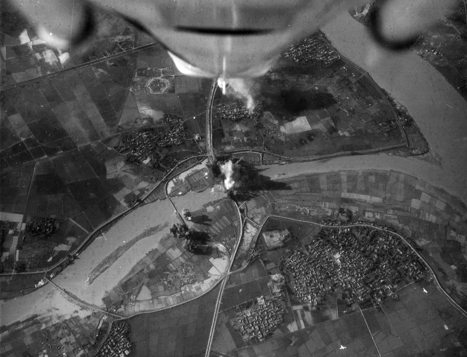 U.S. Navy A-4E Skyhawks attack the Phuong Dinh railroad bypass bridge in North Vietnam.